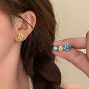 Detail view of trendy Korean style colorful cubic zirconia round stud earrings, chic fashion jewelry.