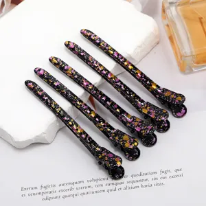 Detailed view of 9.5cm colorful hair duckbill clips, featuring a sleek black splatter design for women.