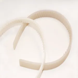 Beige plastic teeth headband detail view, smooth stair hair hoop accessory for daily styling.