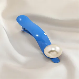 Blue metal duckbill hair clip with large faux pearl detail, elegant hair accessory for women.