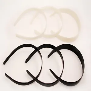 Detail view of simple black and white plastic headbands set, ideal for daily hair styling.