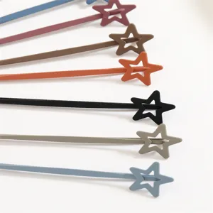 Detailed close-up of colorful hollow star hair clips, smooth touch paint finish, metal bobby pins.