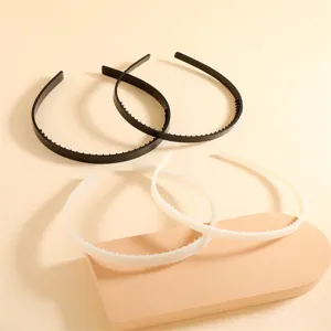 Plastic teeth hair bands set, black and white non-slip hair hoops for daily styling.