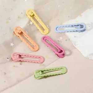 Colorful metal duckbill hair clips set with smooth soft-touch finish for hair styling.
