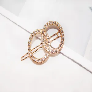 Exquisite rhinestone double-ring hair clip, elegant gold metal bobby pin detail for women