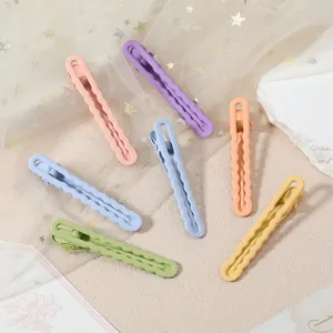 Macaron color metal duckbill hair clips with wave design, smooth hand-feel finish for DIY styling.