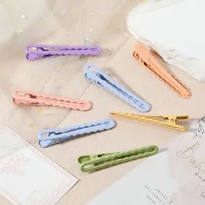 Macaron color metal duckbill hair clips detail shot, showcasing smooth touch paint and vibrant hues.