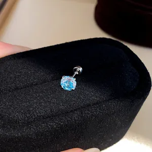 Detailed shot of a Korean-style minimalist colored zircon stud earring with a secure threaded back.