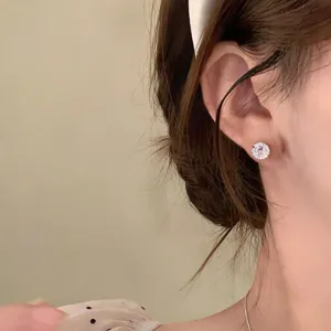 Minimalist round cubic zirconia stud earrings, Korean style fashion delicate ear jewelry detail.