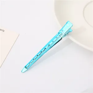 Blue metal duckbill hair clip with hollow design, ideal for hair styling and sectioning.