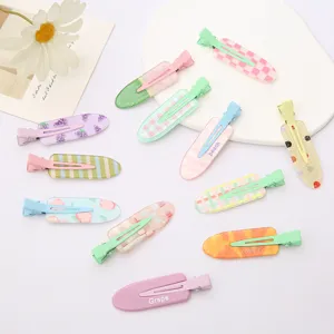 Acrylic duckbill hair clips detail view, colorful pastel plaid and fruit patterns for styling.
