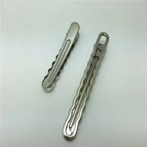Detailed view of silver metal wavy duckbill hair clips, DIY crafting accessories and parts.