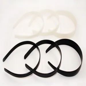 Detail view of simple plastic headbands set in black and white, six pieces pack.
