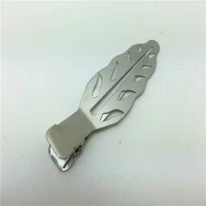 Close-up detail of silver metallic hollow leaf shaped duckbill hair clip accessory