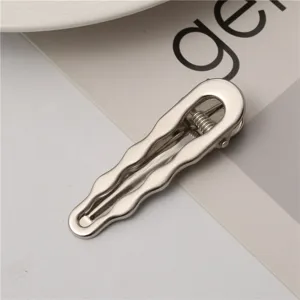 Metallic wavy duckbill hair clip for women, sleek silver side bangs hairpin accessory.