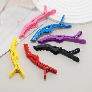 Professional sectional hair crocodile clips in multi-colors for salon styling and coloring.