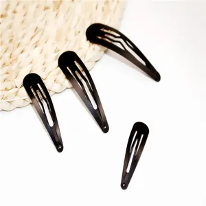 Close-up detail shot of black snap hair clips, metal baking paint DIY hair accessories.