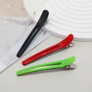 Color plastic hair duckbill clips detail view, professional styling alligator sectioning tools.