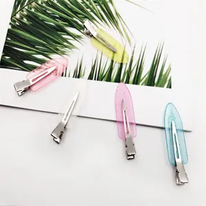 Close-up detail of colorful glitter duckbill hair clips set, transparent resin style.