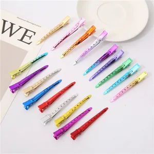 Detailed view of 9.5cm metal duckbill hair clips, colorful salon sectioning tools.