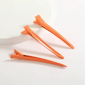 Pinces cheveux bec de canard aluminium orange 9cm professionnelles pour outils de coiffure salon.