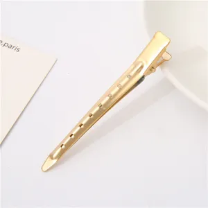 Gold metal hair sectioning clip 9.5cm duckbill hairdressing tool with holes for styling.