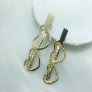 Gold electroplated duckbill hair clips with hollow heart design, fashionable DIY accessories.