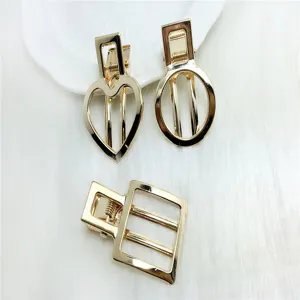 Gold hollow geometric hair clips set featuring heart, round and square shapes for women