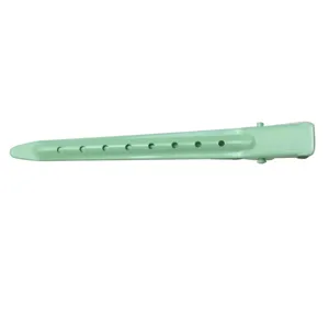 Light green metal duckbill hair clip detailed view, featuring hollow design for sectioning.