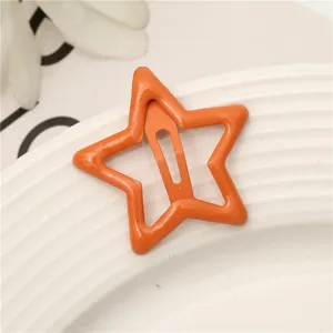 Horquilla de pelo de estrella naranja primer plano, lindo clip BB de metal color caramelo para niñas niños.