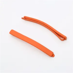 Close-up detail of 6cm orange matte bobby pin, showing smooth texture and simple minimalist hair clip.