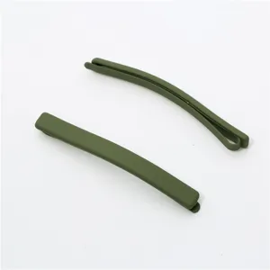 Close-up detail of matte olive green hair clips, minimalist bobby pins for everyday styling.