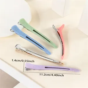 Colorful plastic hair sectioning clips with metal duckbill design for professional salon styling.