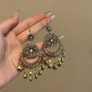 Vintage bohemian gold-plated flower tassel dangle earrings exquisite detail close-up view.