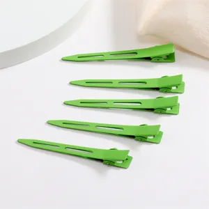 Detailed view of green metal duckbill hair clips, candy color coating, perfect for cute styling.