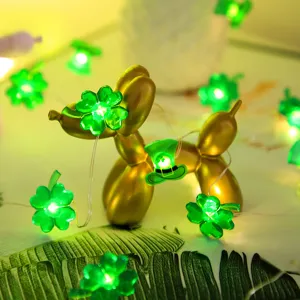 St. Patrick's Day LED string lights with clover and green hat designs for party decor