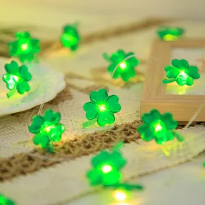 St. Patrick's Day green four leaf clover LED string light detail view showcasing glowing lamps.