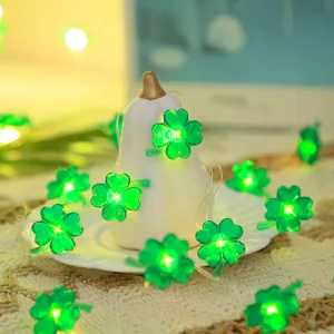 St. Patrick's Day LED string lights with green four-leaf clover design for party decor.