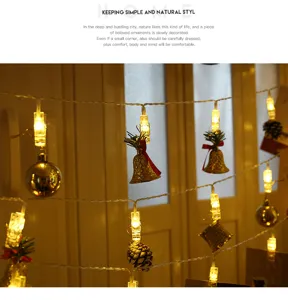 Catena luminosa LED con mollette portafoto e ciondoli decorativi per camera e festa.