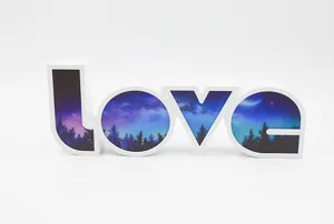 LED love letter night light with starry forest design for romantic room and party decor.