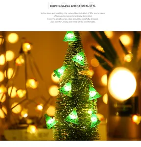 Guirnalda de luces LED de alambre de cobre decorativa navideña con adorables adornos de muñecos.