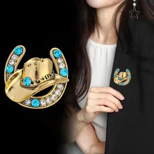 Detailed view of creative rhinestone cowboy hat horseshoe brooch, elegant suit accessory.