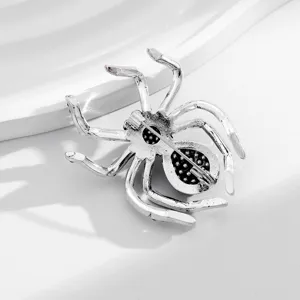 Detailed view of alloy retro spider brooch pin back, gothic fashion costume jewelry.