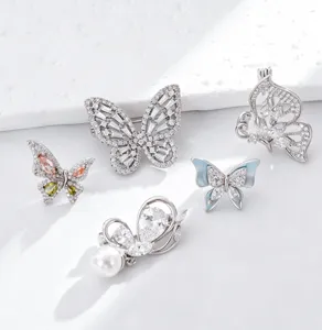 Exquisite copper cubic zirconia butterfly brooches set with pearls and elegant details.