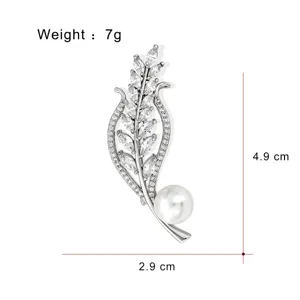 Elegant pearl wheat brooch with sparkling cubic zirconia crystals, measuring 4.9x2.9cm.