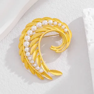 Elegant gold-tone pearl and feather brooch, gentle workplace fashion accessory pin for women.