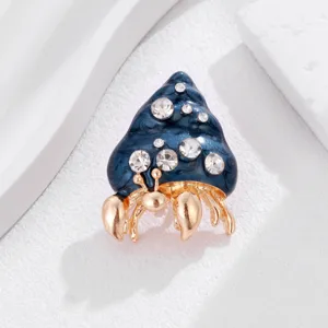 Exquisite enamel hermit crab brooch featuring sparkling rhinestones and gold alloy detailing.