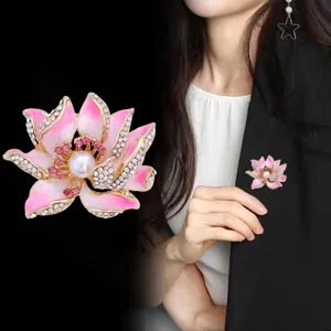 Exquisite pink lotus enamel rhinestone brooch with pearl center, elegant floral jewelry.