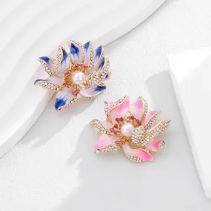 Elegant enamel lotus brooch pin with sparkling rhinestones and pearl center, ideal for qipao.