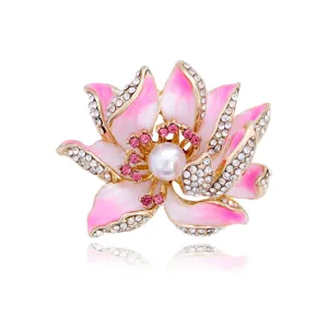 Lotus flower brooch detail with pink enamel petals, sparkly rhinestones and central pearl accent.